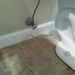 water damage restoration behind toilet