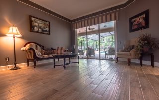 Wood-Look Tile Flooring Family Room Overlooking Pool