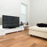 Wire-Brushed Natural Hickory Wood Flooring in Living Room with white sleek furniture