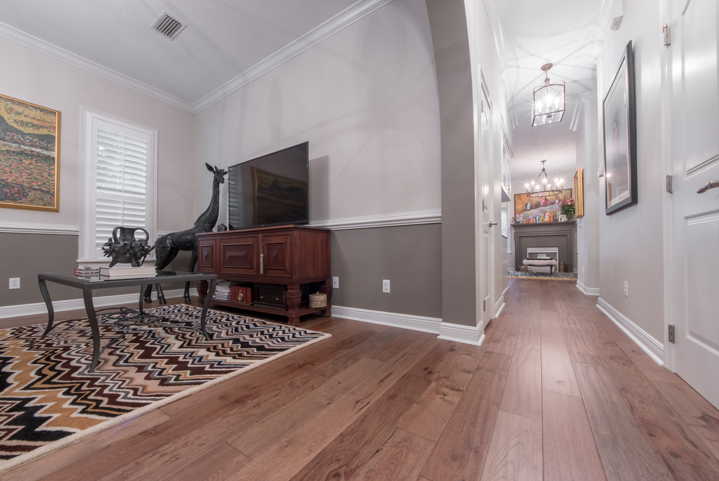 Wire-Brushed Brown Hickory flooring entertainment room and hallway view
